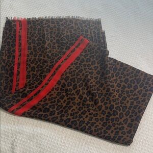 Brown and black leopard scarf with red stripe accents